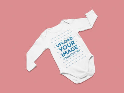 Mockup of a Long Sleeve Onesie Against a Solid Surface 25326