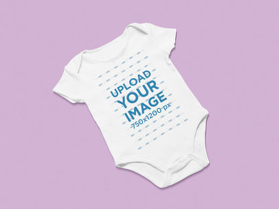 Mockup of a Flat Laid Onesie on a Flat Surface