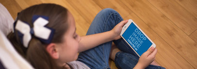 iPhone 7 in Landscape View Mockup of a Little Girl Playing in her Room