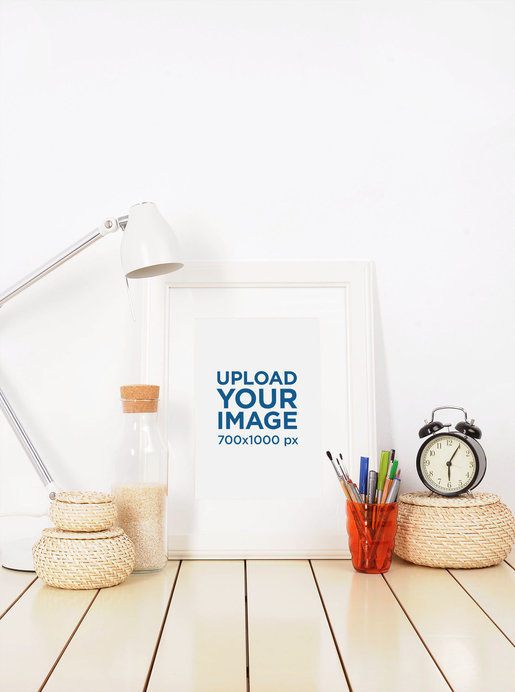 Placeit - Mockup of an Art Print on a Desk Next to a Lamp