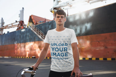 T-Shirt Mockup of a Man in Front of a Ship at the Docks 34121-r-el2