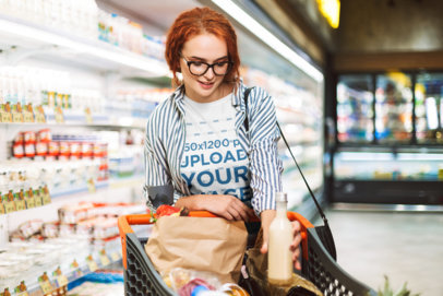 T-Shirt Mockup of a Woman Doing Grocery Shopping