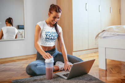 Crop Top T-Shirt Mockup of a Woman Sitting on Her Bedroom's Floor