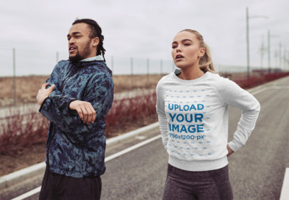 Heathered Sweatshirt Mockup Featuring Two Joggers on a Road