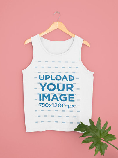 Front-View Mockup of a Tank Top on a Hanger by a Plant