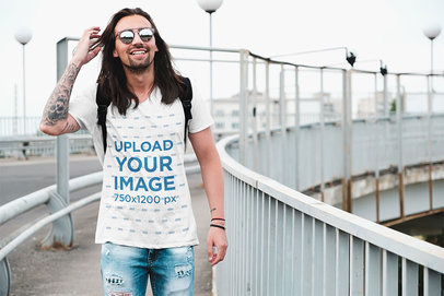 T-Shirt Mockup of a Tattooed Man in an Urban Setting