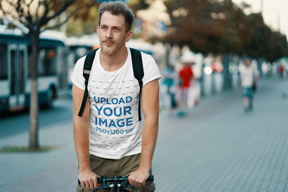 T-Shirt Mockup of a Man Riding His Bicycle on a Street 34118-r-el2
