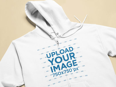 Closeup Mockup of a Hoodie Laid on a Flat Surface
