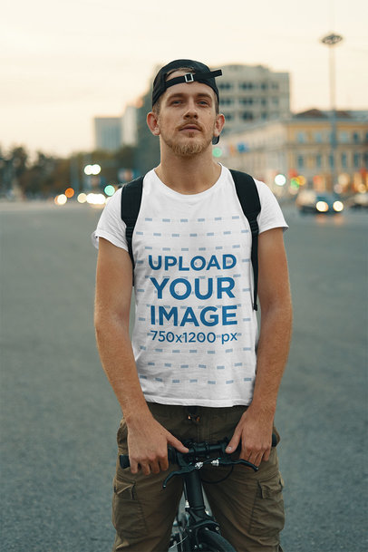 T-Shirt Mockup Featuring a Man Riding a Bicycle