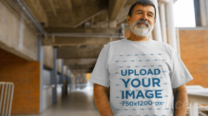 T-Shirt Video Featuring a Senior Man Standing on a Hallway 
