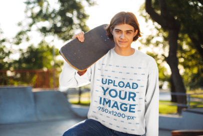 Mockup of a Youngster with a Sweatshirt Holding a Skateboard 