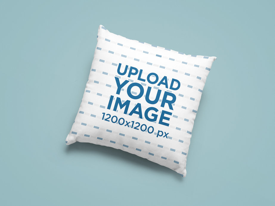 Mockup of a Sublimated Square Pillow Placed on a Plain Color Surface 