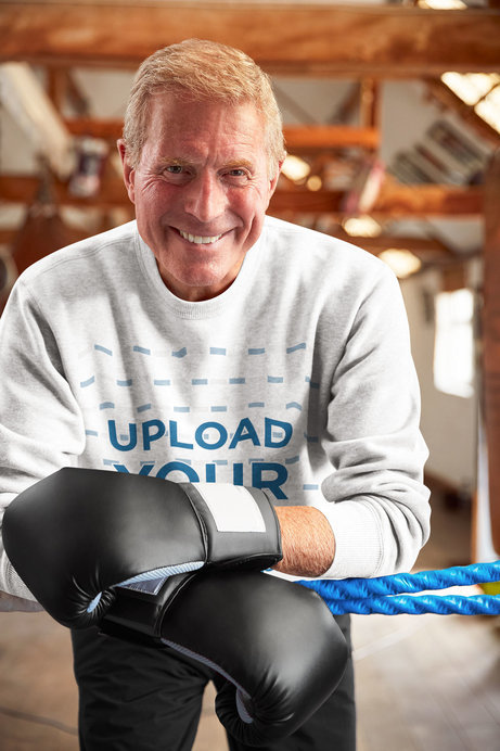 Sweatshirt Mockup Featuring an Elderly Man with Boxing Gloves