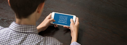 iPhone 6 Mockup Generator Featuring a Young Man