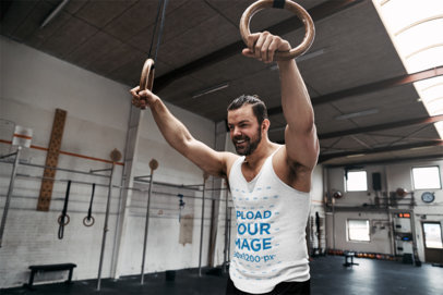 Tank Top Mockup Featuring a Strong Man Doing a Gymnastic Rings Workout 34060-r-el2