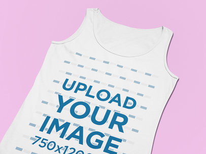 Closeup Mockup of a Flat Laid Tank Top on a Solid Surface
