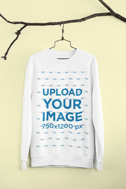 Mockup of a Crewneck Sweatshirt Hanging on a Branch