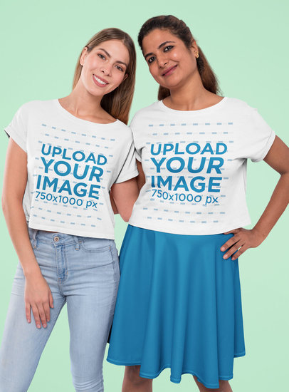 Mockup of Two Best Friends Wearing Crop Top Tees at a Studio