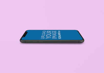 Mockup of an iPhone 11 Laid Horizontally on a Colored Surface 1998-el1
