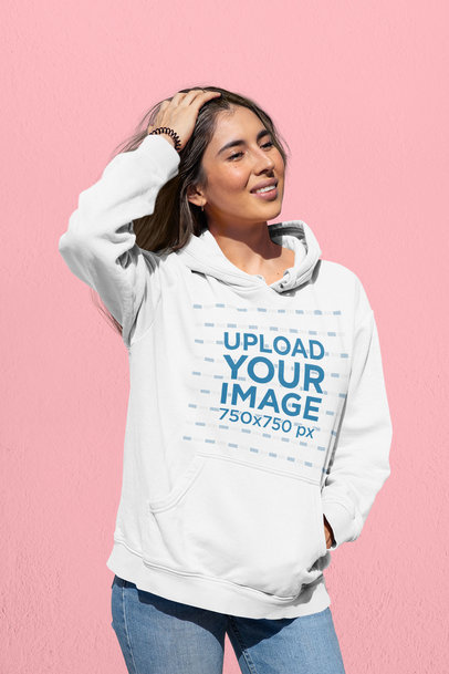 Hoodie Mockup of a Woman at a Studio Touching her Head 