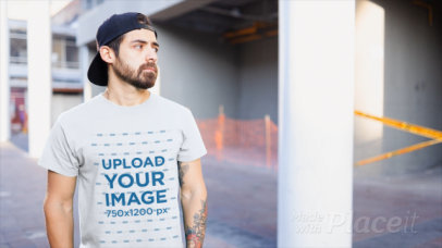 T-Shirt Video of a Tattooed Bearded Man at a Construction Site