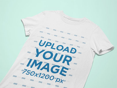 Closeup View Mockup of a Flat Laid Tee on a Solid Surface