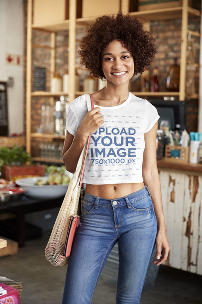 Crop Top Mockup of a Curly-Haired Woman at a Restaurant