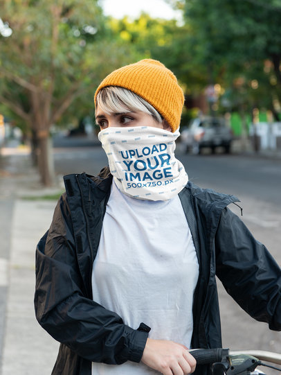 Neck Gaiter Mockup of a Young Woman Covering Her Face on the Street