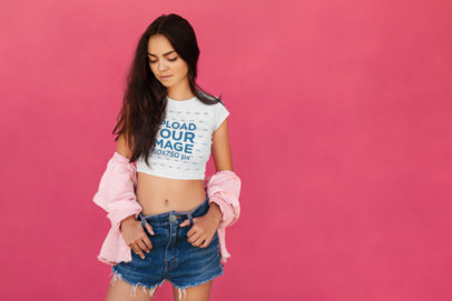 Crop Top Tee Mockup of a Young Woman Posing by a Pink Wall 