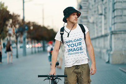 Mockup of a Man with a Round Neck Tee Walking with His Bike