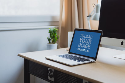 Mockup of a MacBook on a Desk with a Bigger Screen 3808-el1