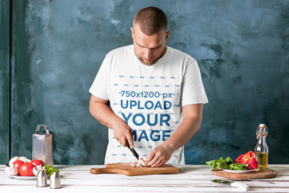 T-Shirt Mockup of a Man Cutting Vegetables