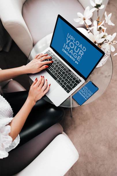iPhone 11 Pro Mockup of a Businesswoman Working on Her MacBook Pro 