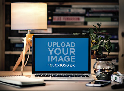 Mockup of a MacBook in a Cozy Home Office