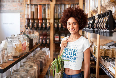 Crop Top Tee Mockup of a Woman at an Eco-Friendly Grocery Store