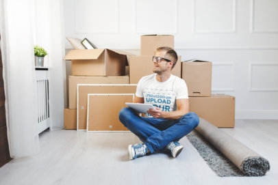 T-Shirt Mockup Featuring a Man by Some Moving Boxes
