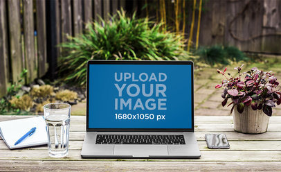 Mackbook Mockup Featuring a Wooden Table in a Backyard 3816-el1