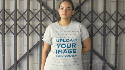 Plus Size T-Shirt Video of a Woman Leaning Against a Gate 12525