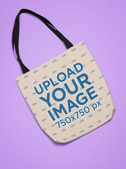 Mockup of a Flat Laid Sublimated Tote Bag on a Solid Surface