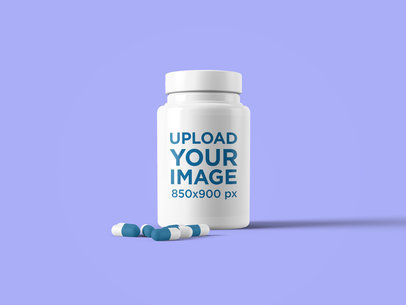 Mockup of a Plastic Pill Bottle Featuring a Few Pills