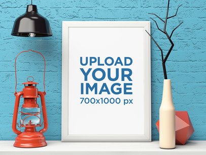 Mockup of a Framed Art Print Placed on a Shelf Among Decorative Items 