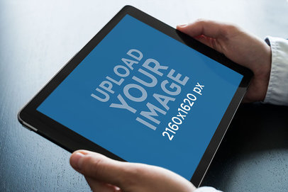Mockup of a Man Holding an iPad in Landscape Position with His Two Hands 2038-el1