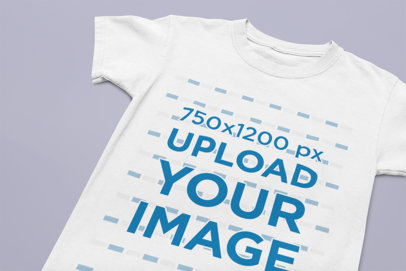 Children's Tee Mockup Featuring a Solid Color Backdrop 33943