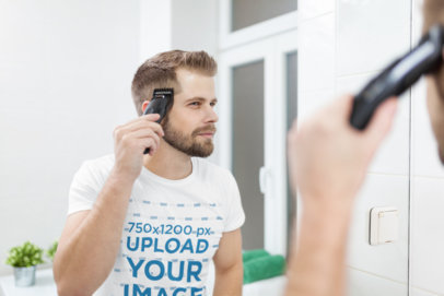 T-Shirt Mockup of a Man Cutting His Hair with an Electric Razor