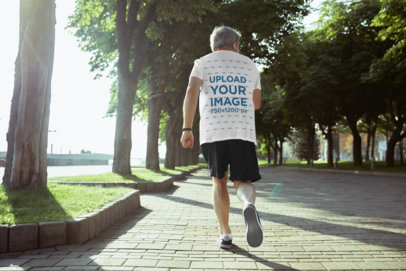 T-Shirt Mockup of a Senior Man Jogging in the Park 34387-r-el2