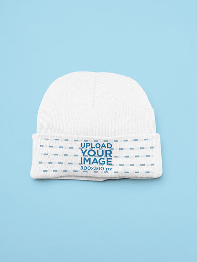 Mockup of a Beanie Flat Laid on a Customizable Background