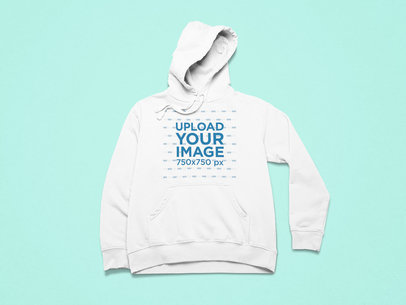 Front-View Mockup of a Hoodie Placed in a Minimalist Setting 25496