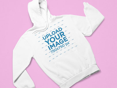 Flat Lay Mockup of a Pullover Hoodie Against a Customizable Background