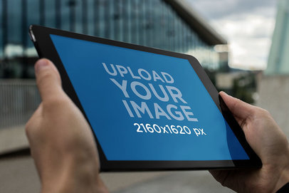 Mockup of an iPad Being Held in Landscape Position by a Man 2047-el1