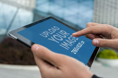 Mockup of a Man Manipulating an iPad in Landscape Position 2048-el1